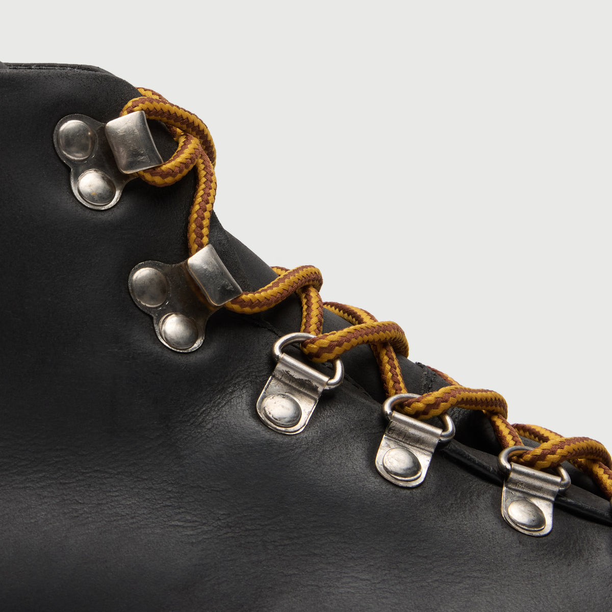 Walk London Blackheath Hiking Boots in black leather close up of yellow and brown laces, D-rings and hooks