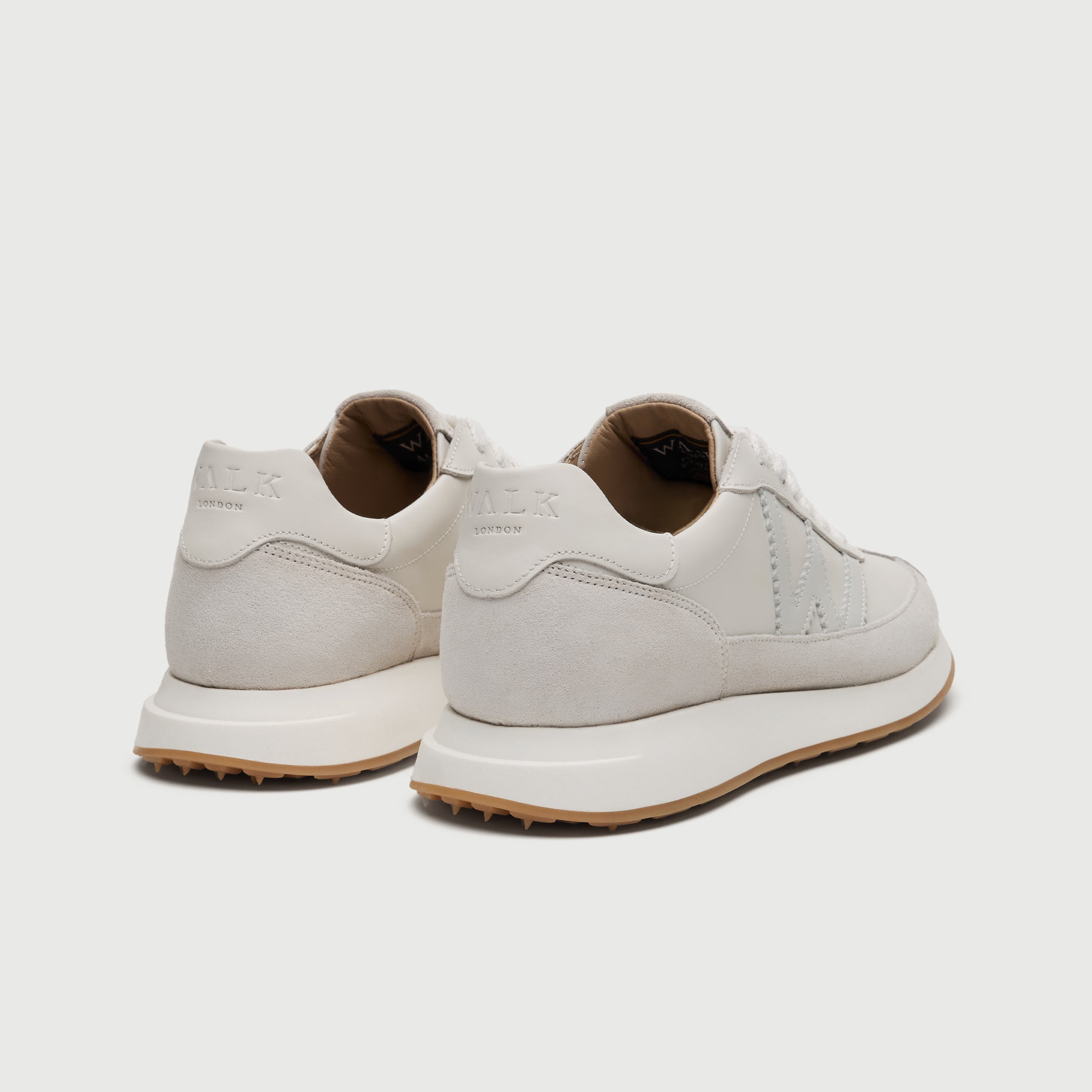 Walk London Chiswick white leather trainer heel view showing debossed branding on heel counter 