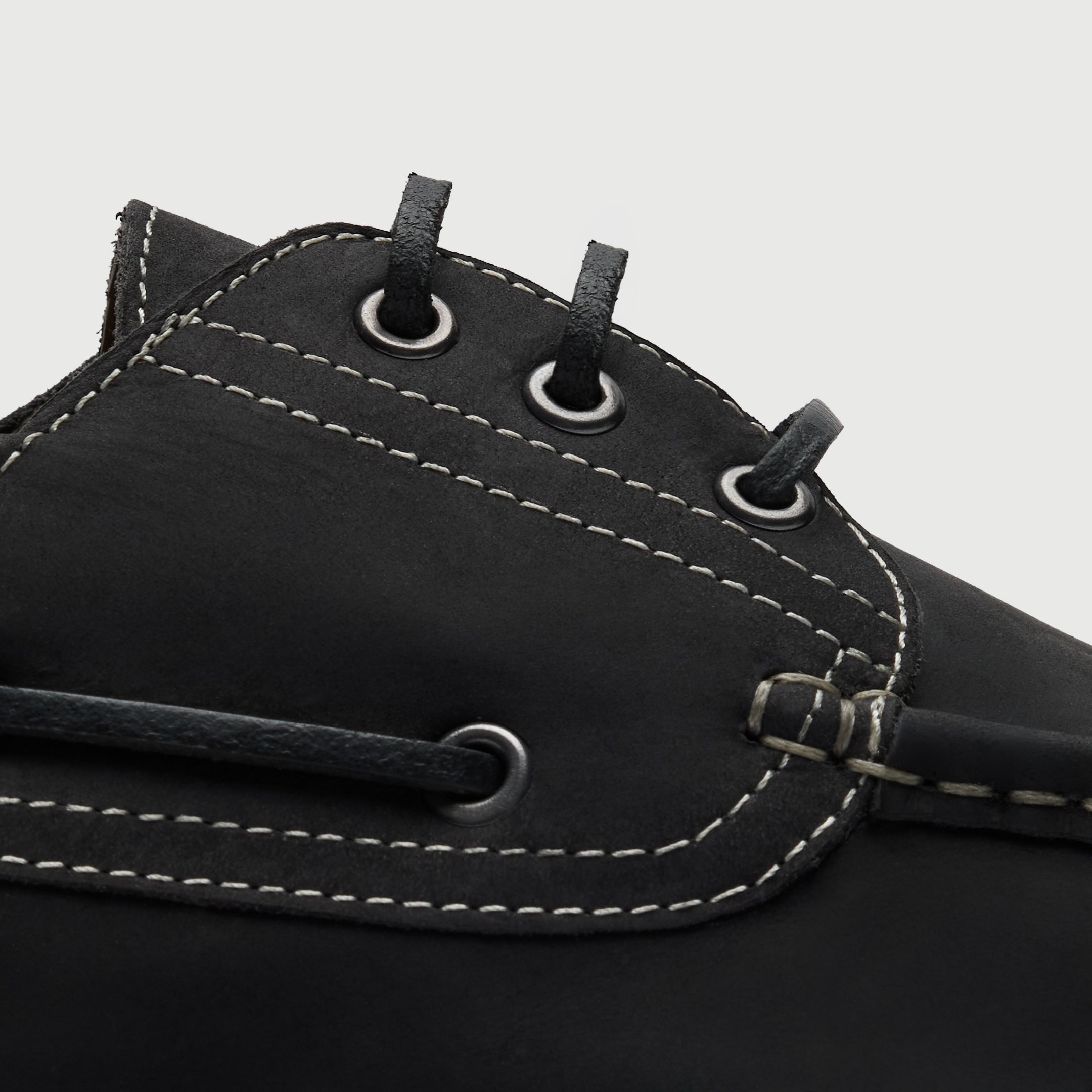 Walk London Hackney Boat Shoe in matte charcoal black leather with contrast stitch close up view showing leather laces and eyelets