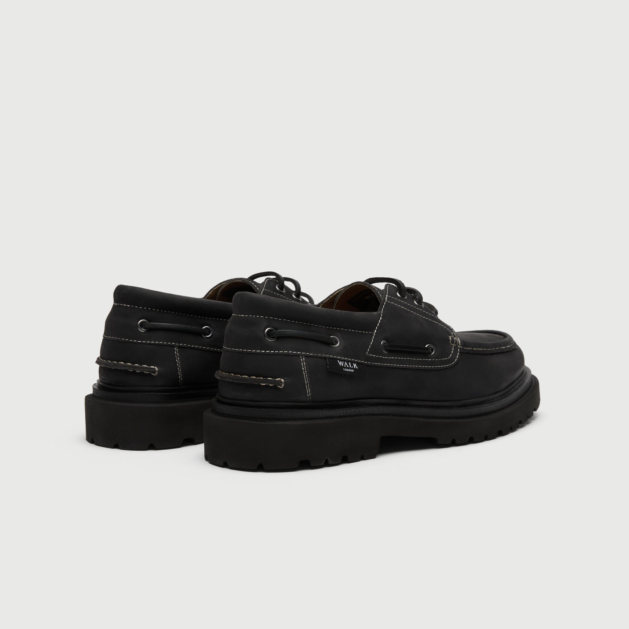 Walk London Hackney Boat Shoe in matte charcoal black leather with contrast stitch heel view showing branded label