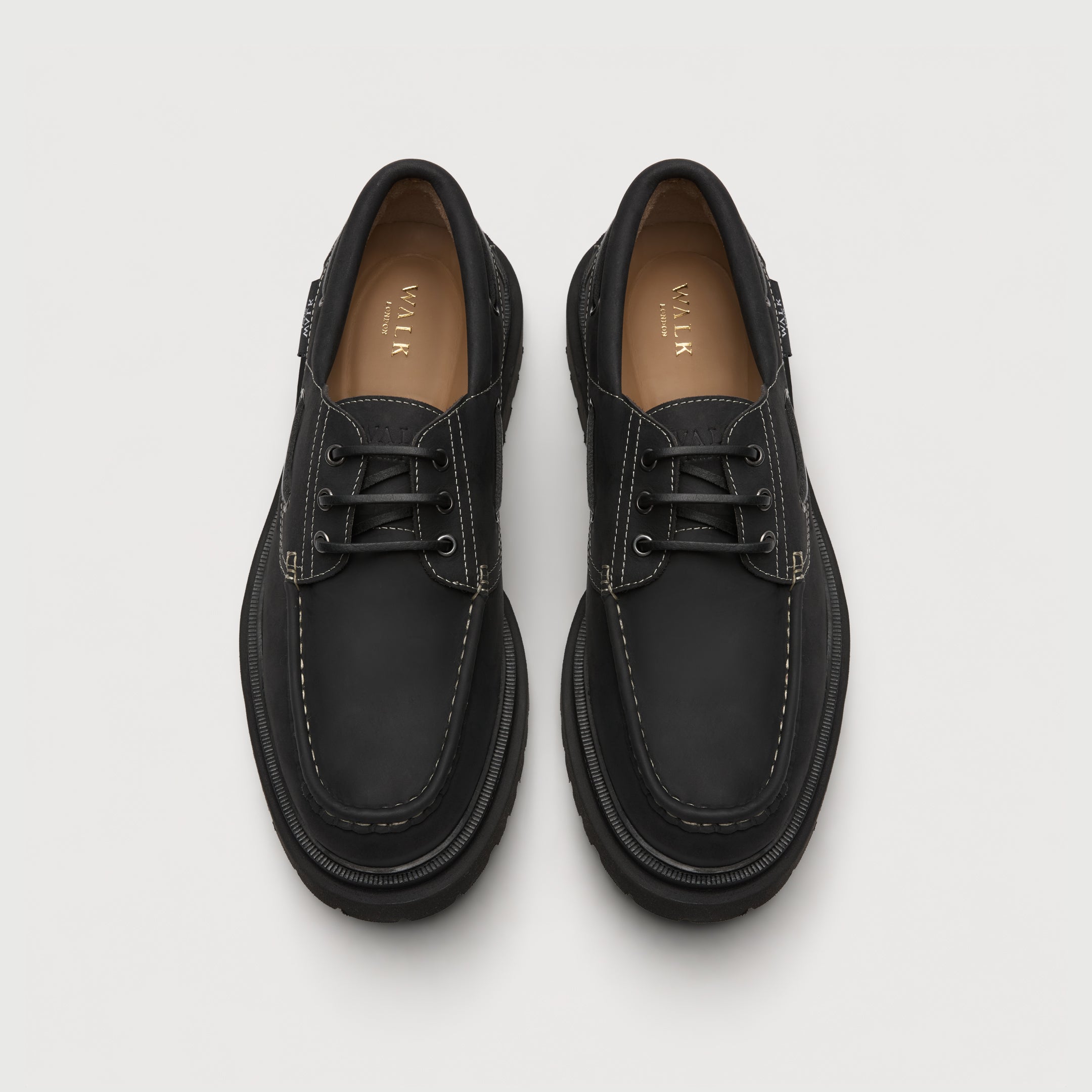 Walk London Hackney Boat Shoes in matte charcoal black leather with contrast stitch top view showing tan insole with gold branding