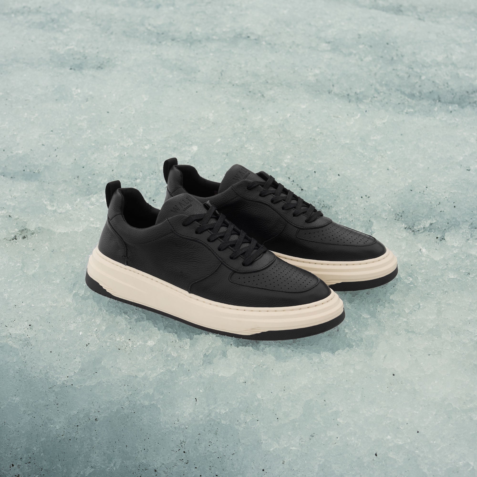 black and white leather mens trainers on ice glacier