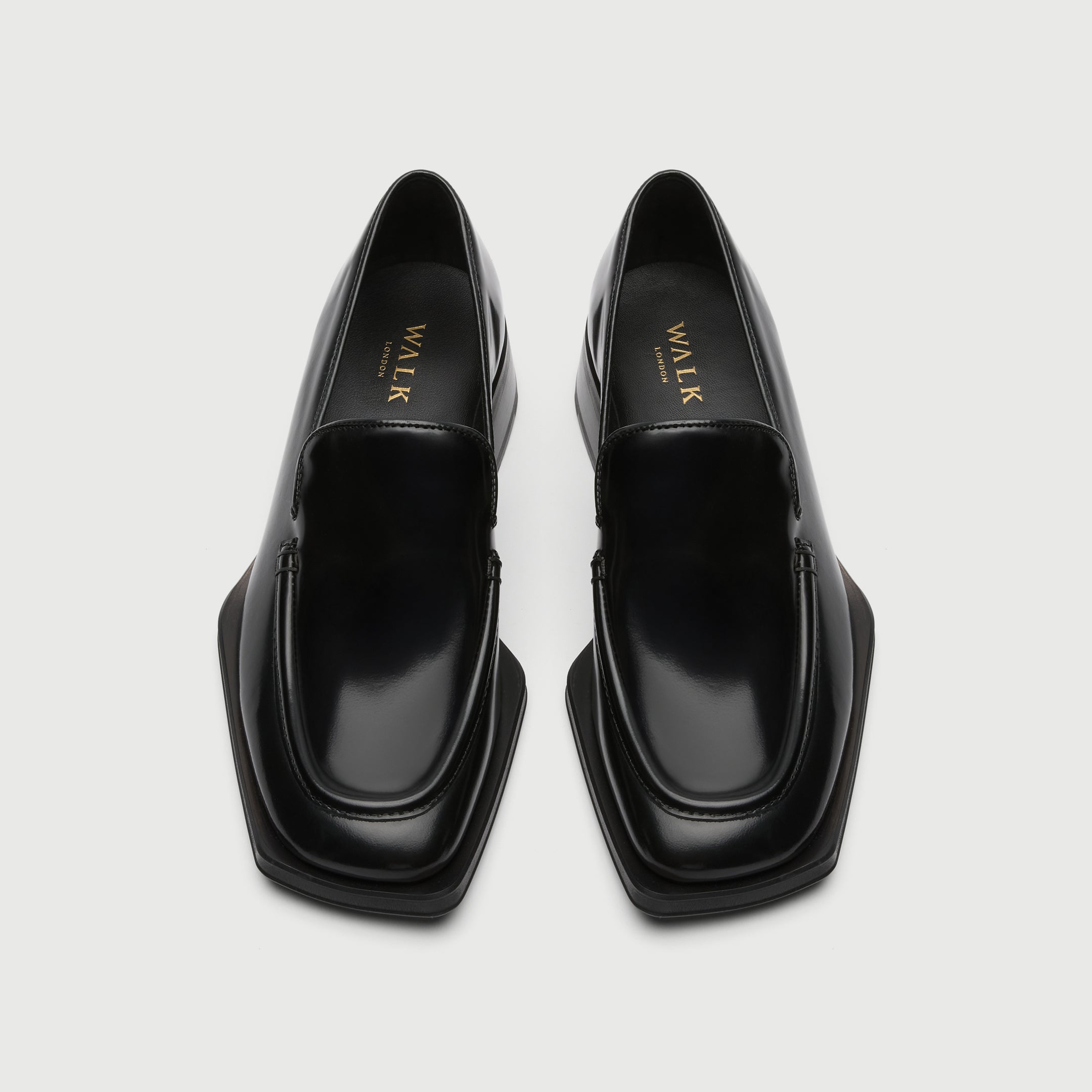 Black leather loafer with a light grey background - Walk London Abbey Loafer Birds eye view