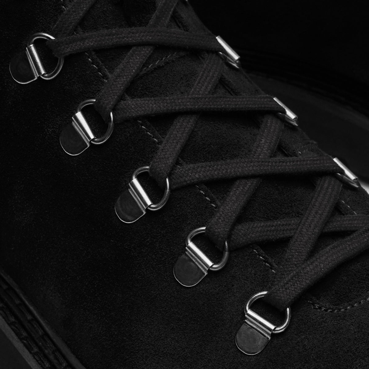 Walk London Clapham Lace Boot in black suede close up view showing silver toned d-rings and flat black laces