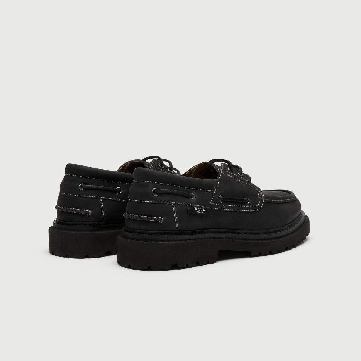 Walk London Hackney Boat Shoe in matte charcoal black leather with contrast stitch heel view showing branded label