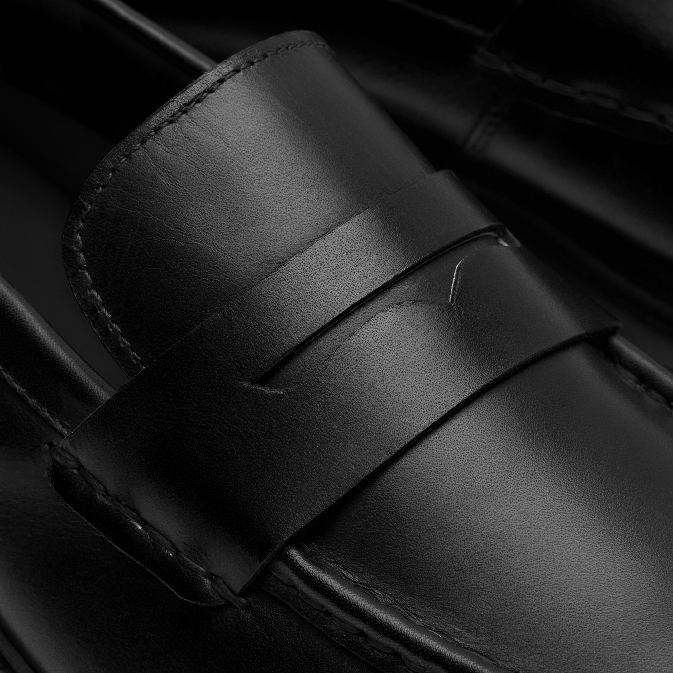 Walk London Hackney Saddle Loafer in Black Leather close up view of cut out in saddle strap