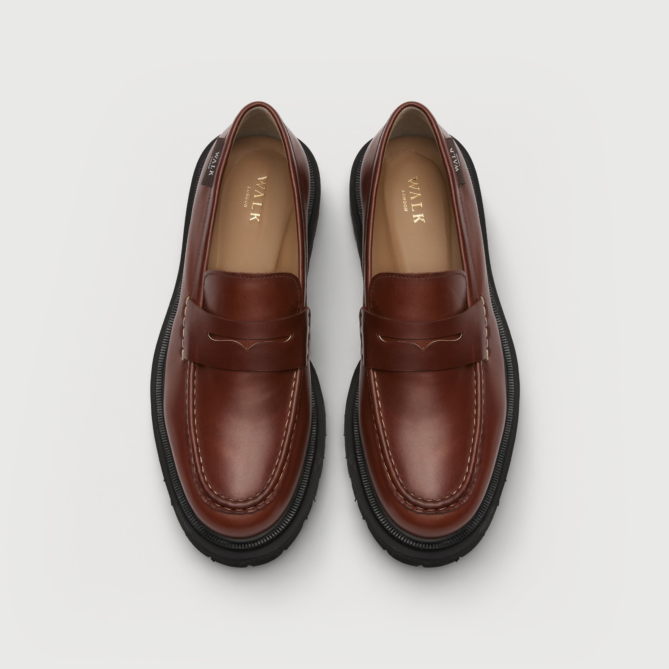 Walk London Hackney Saddle Loafer in Tan Leather top view showing beige insole with gold foil branding and tonal stitching.