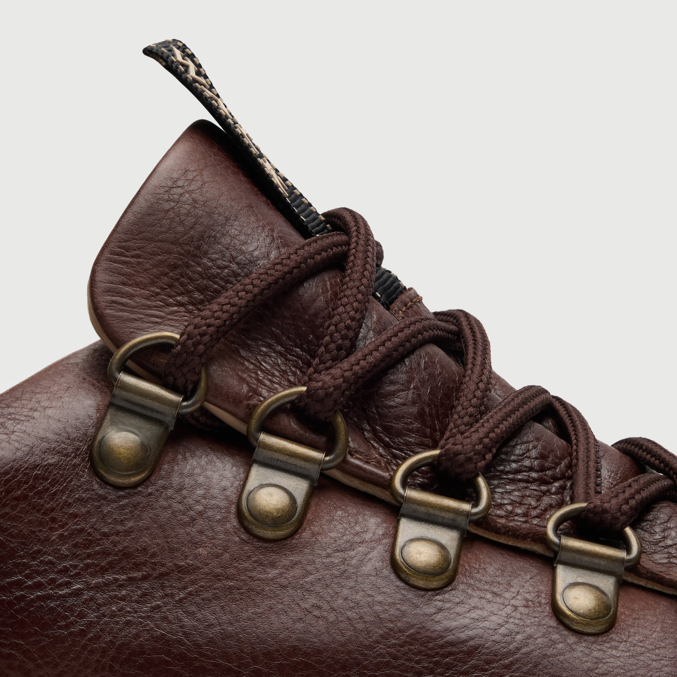 Walk London Hampstead Hiking Style Trainer in Brown Leather close up of brass toned d-rings and brown laces