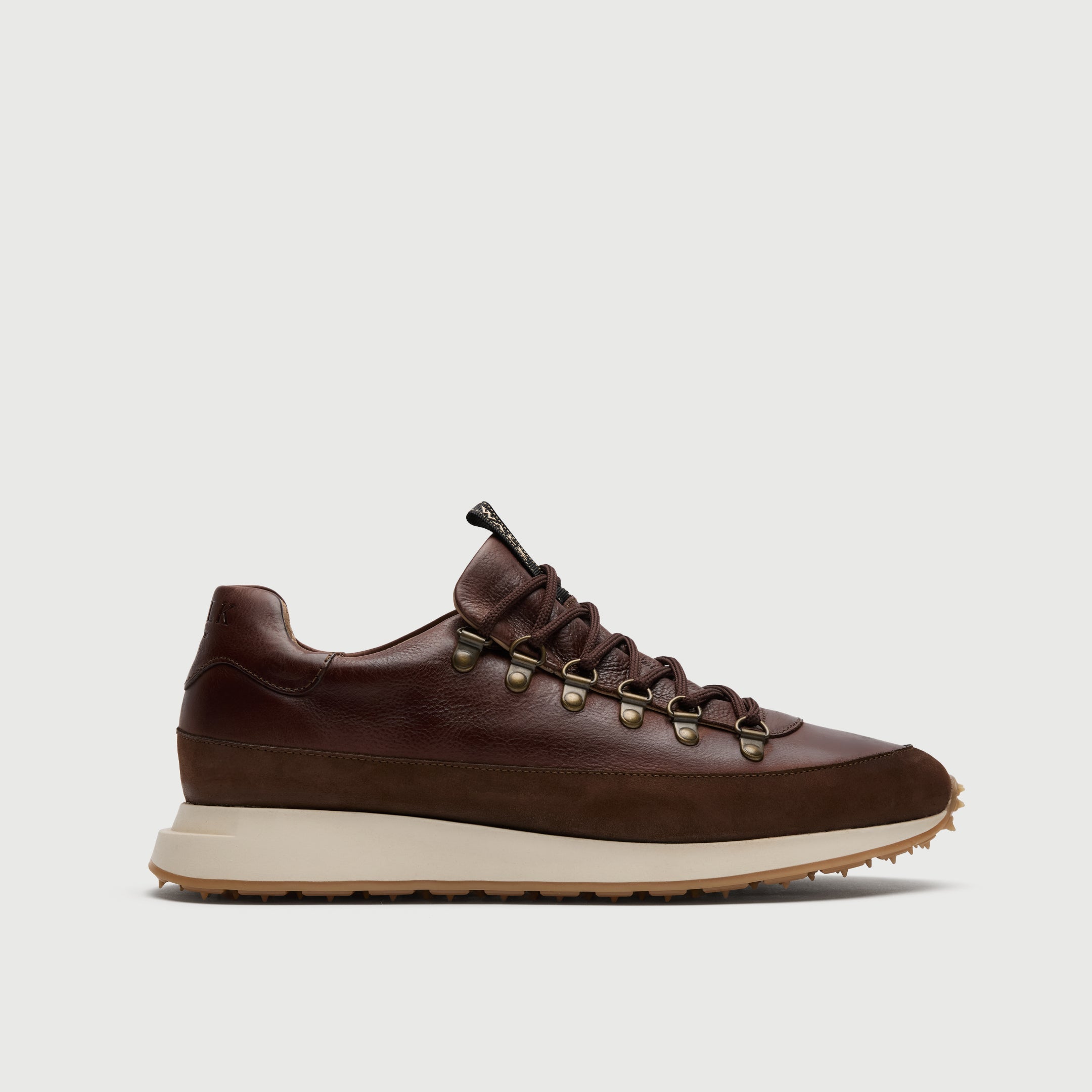 Walk London Hampstead Trainer in Brown Leather side view showing hiking style laces and brass toned d-rings with off-white midsole