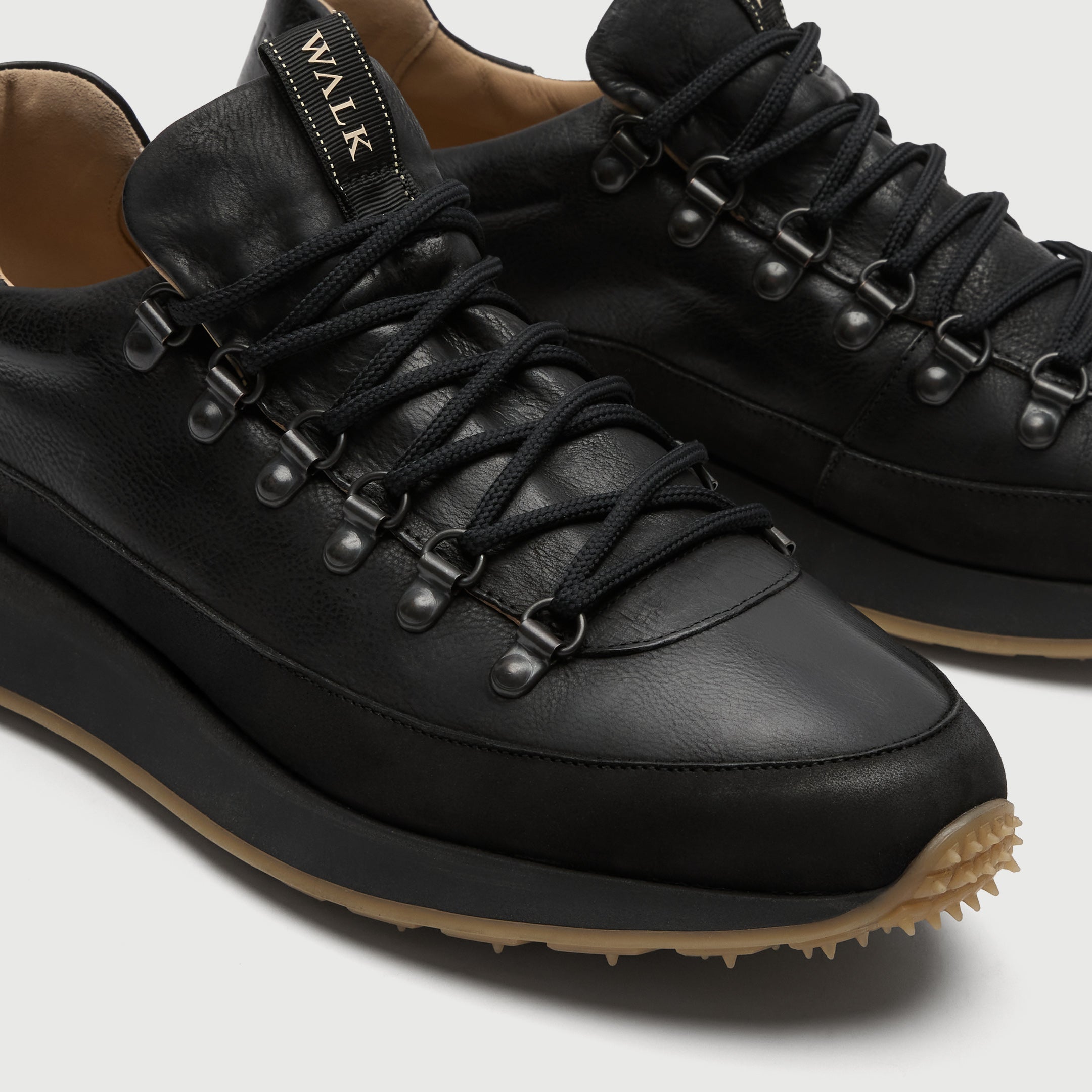 Black leather walk london hampsetad hiking sneaker on a light grey background