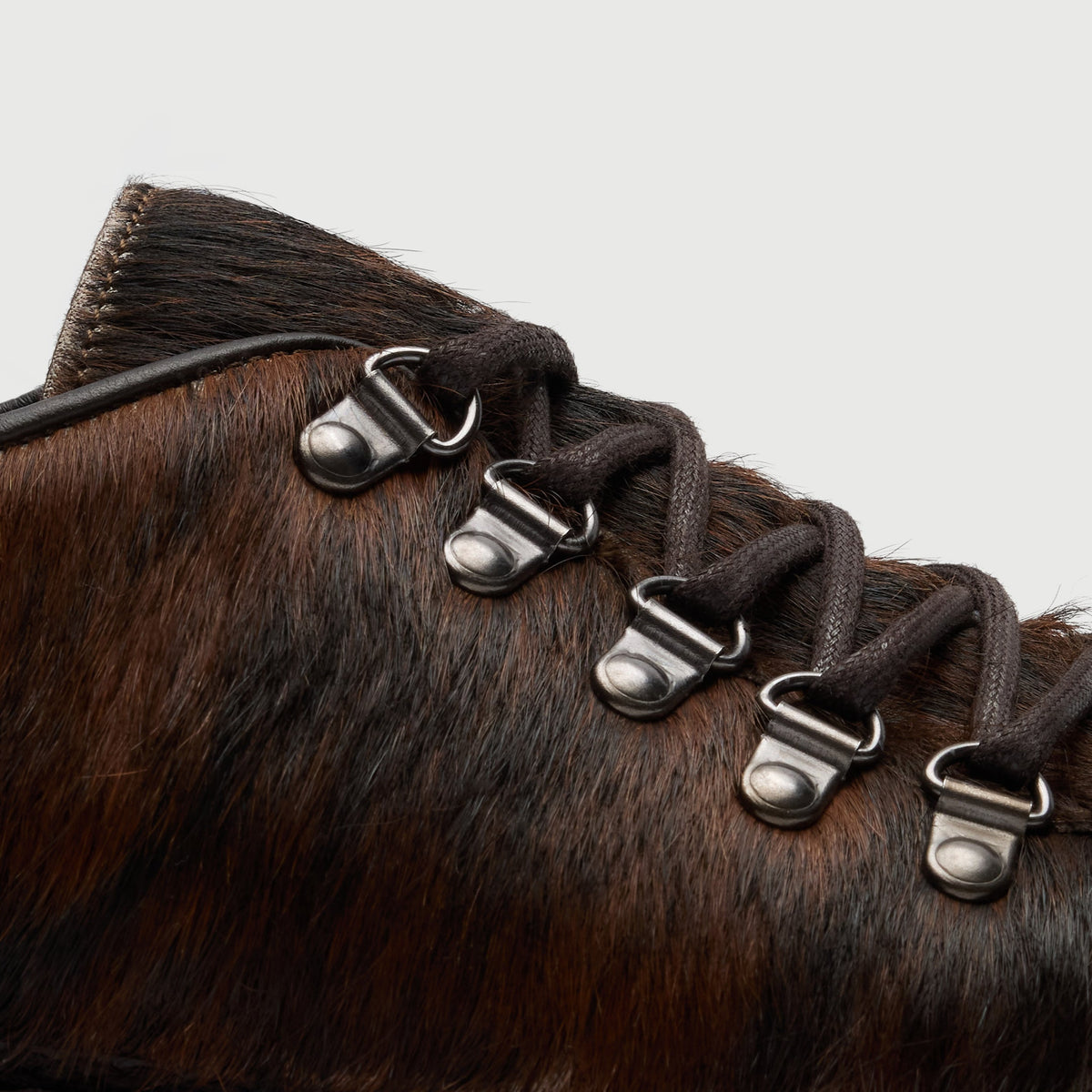 Walk London Hartford Hiking Style Shoe in Brown Pony Hair close up side view of silver toned d-rings and brown laces