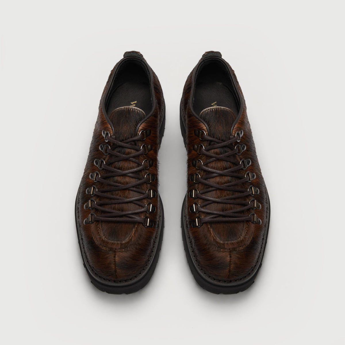 Walk London Hartford Hiking Style Shoe in Brown Pony Hair top view showing brown laces, d-rings, and black insole with gold branding