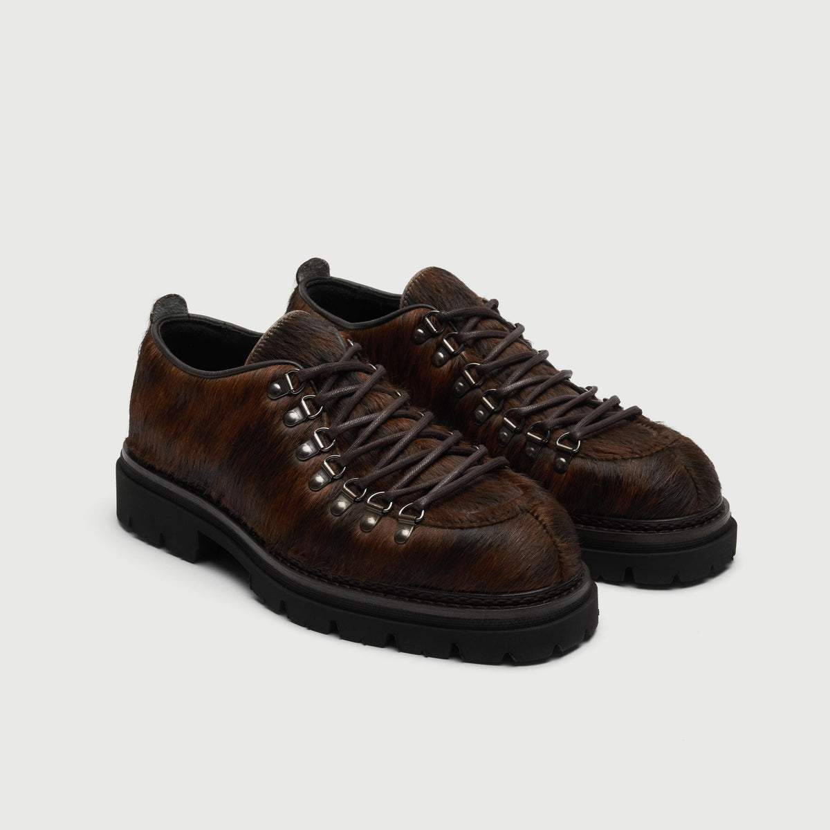 Walk London Hartford Hiking Style Shoes in Brown Pony Hair three quarter view showing brown laces and silver toned d-rings