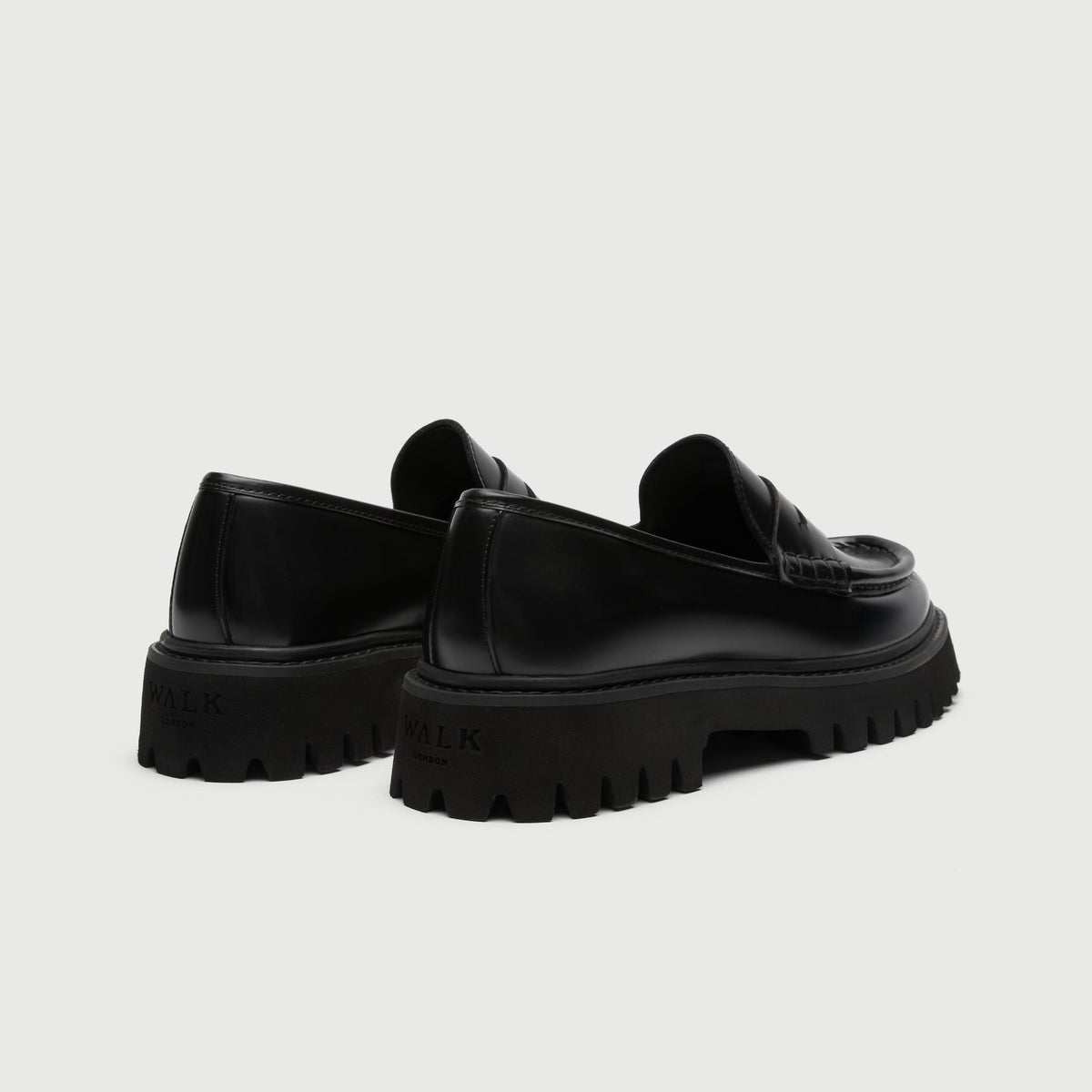 Walk London Hopper Saddle Loafers in Black Smooth Leather heel view showing debossed branding on heel of chunky sole