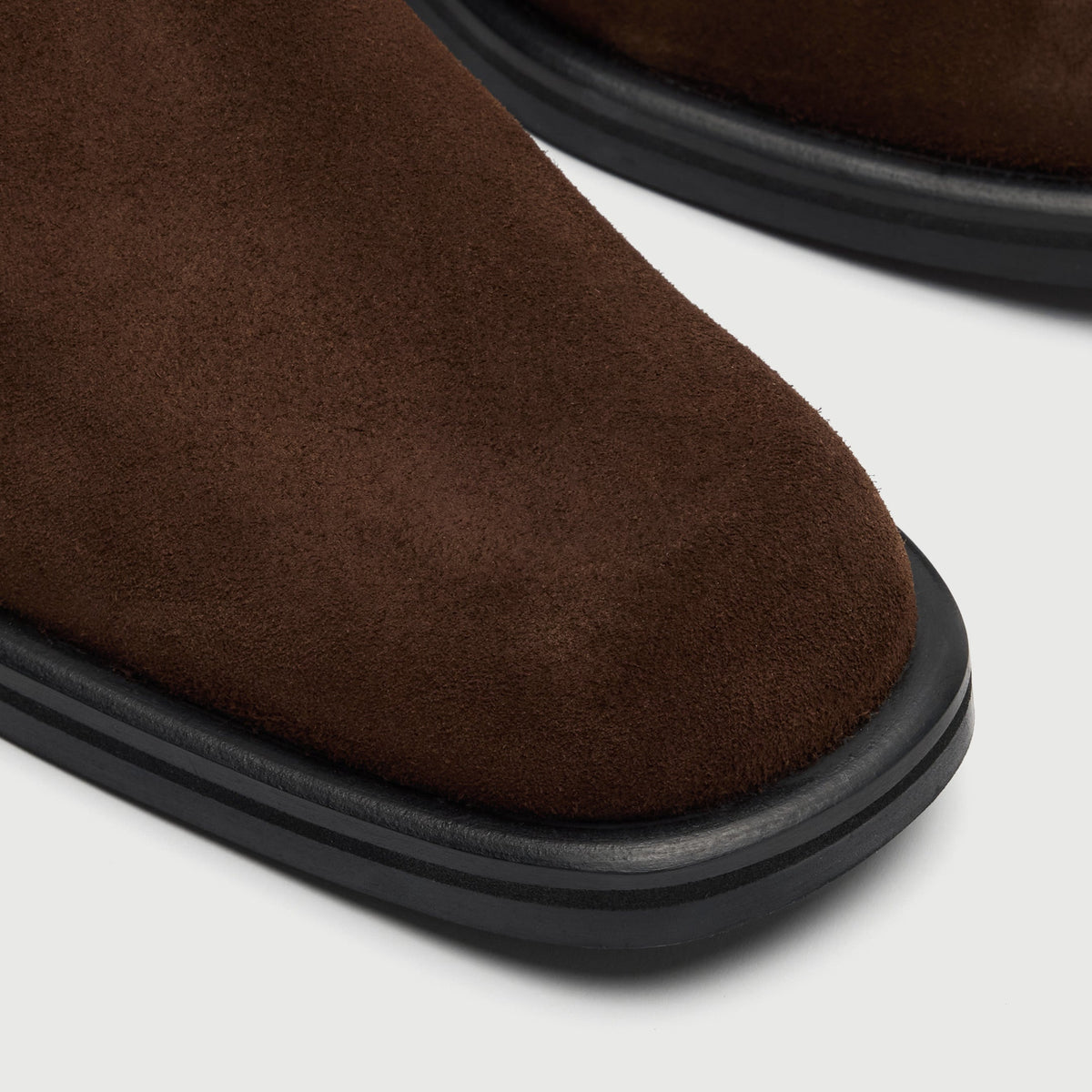 Walk London Lambeth Chelsea Boot in Brown Suede close up view of subtle squared toe and lack sole