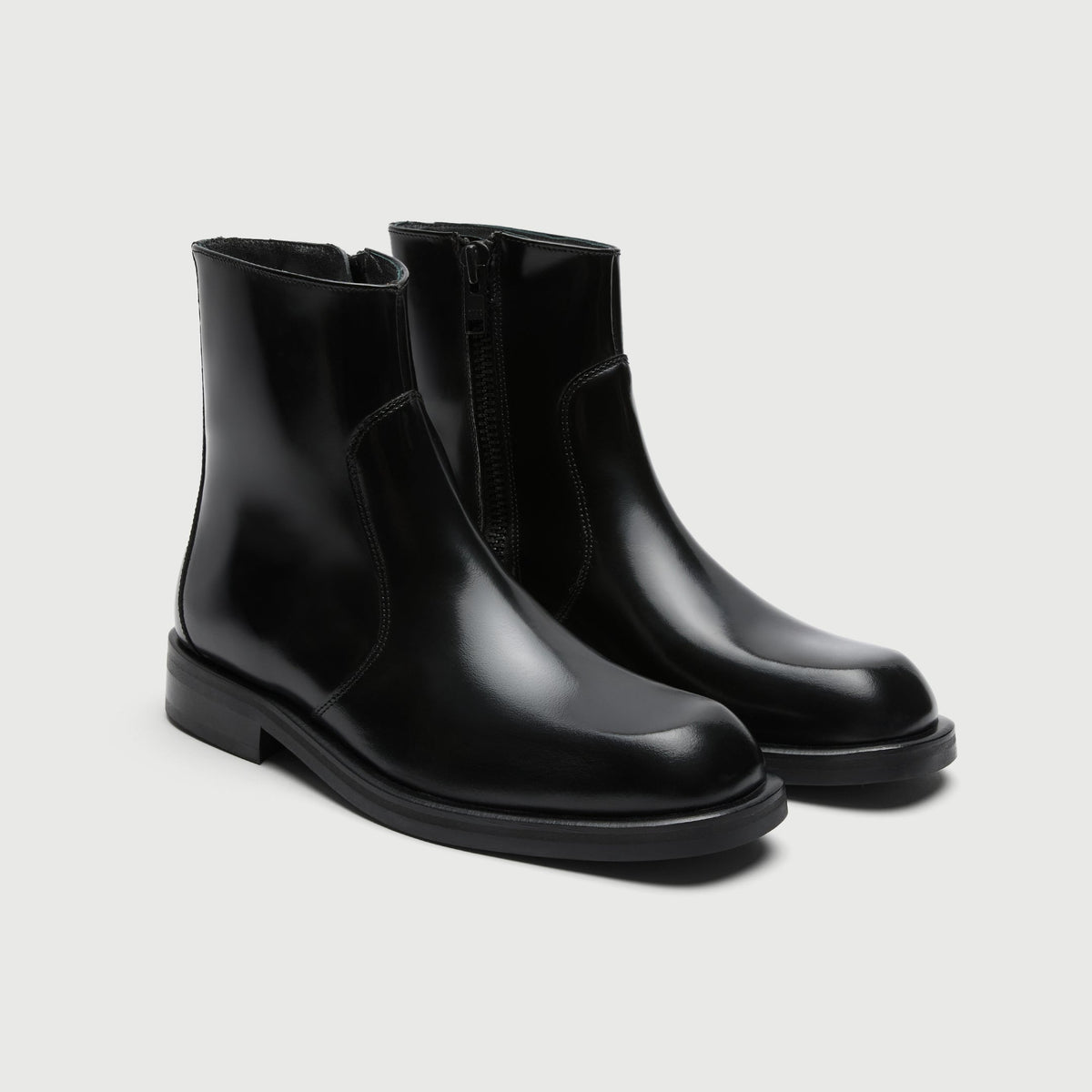 Walk London Lambeth Seam Zip Boots in Black Smooth Leather three quarter view showing subtly squared toe and seam panel up front instep and crown