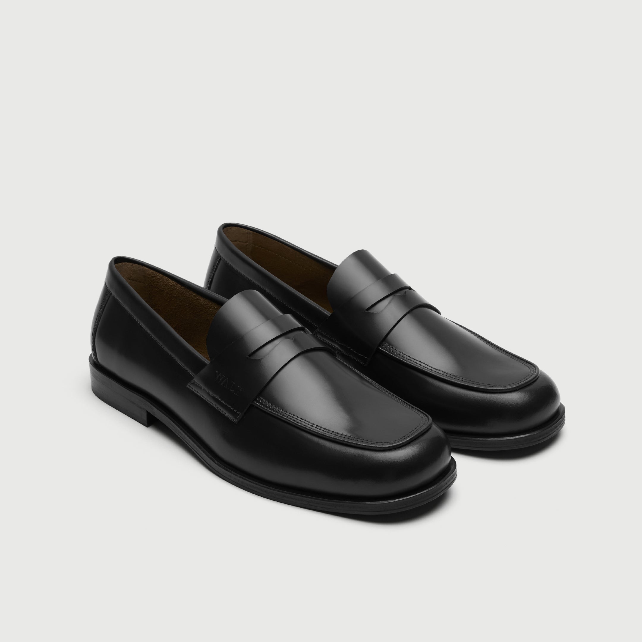 Walk London Marylebone Saddle Loafers in Black Leather three quarter view showing cut out in saddle