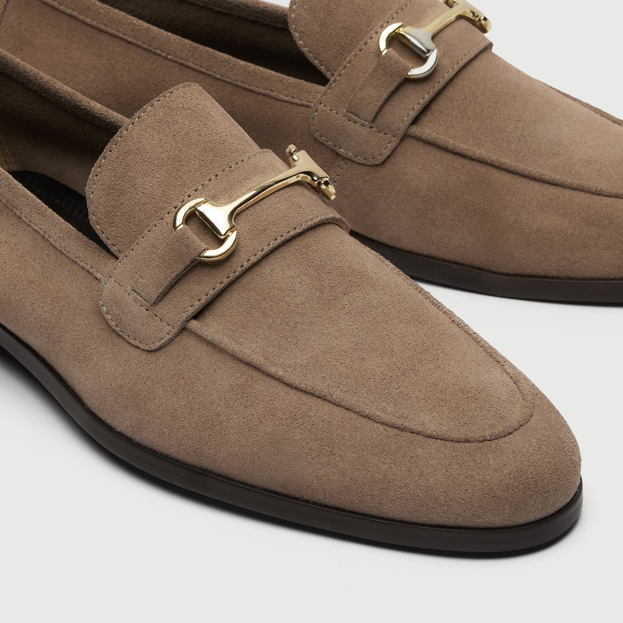 Walk London Naples beige loafer with gold horse bit trim close up view of toe