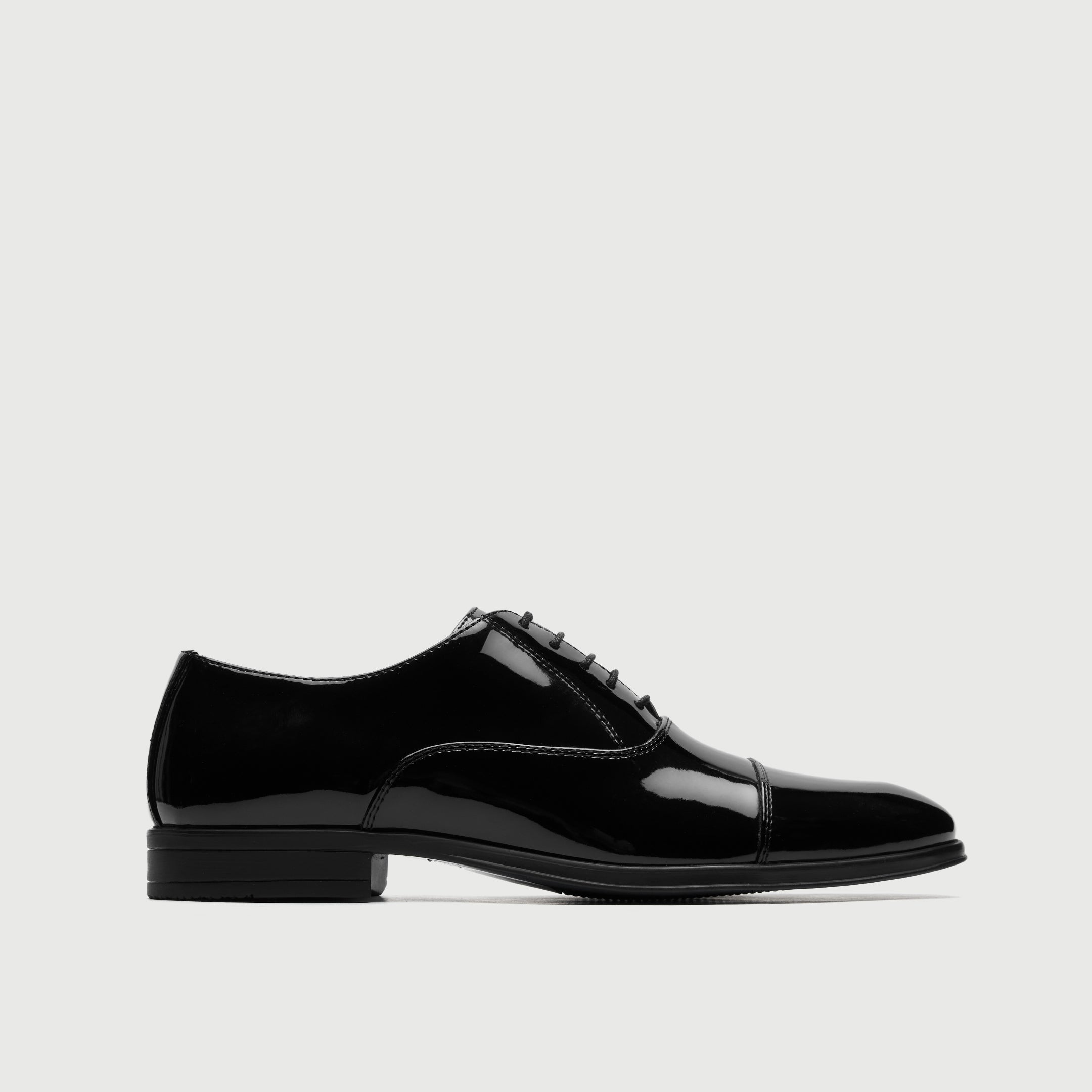 Walk London Oscar Black patent leather dress shoe on a light gray background