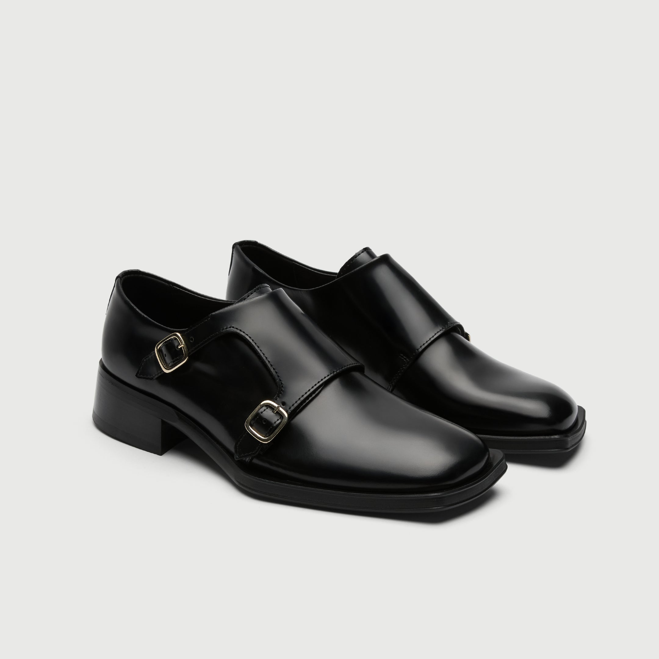 Black leather shoe with a buckle on a light grey background - Walk London Abbey Monk Shoe Side view