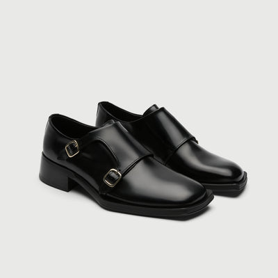 Black leather shoe with a buckle on a light grey background - Walk London Abbey Monk Shoe Side view
