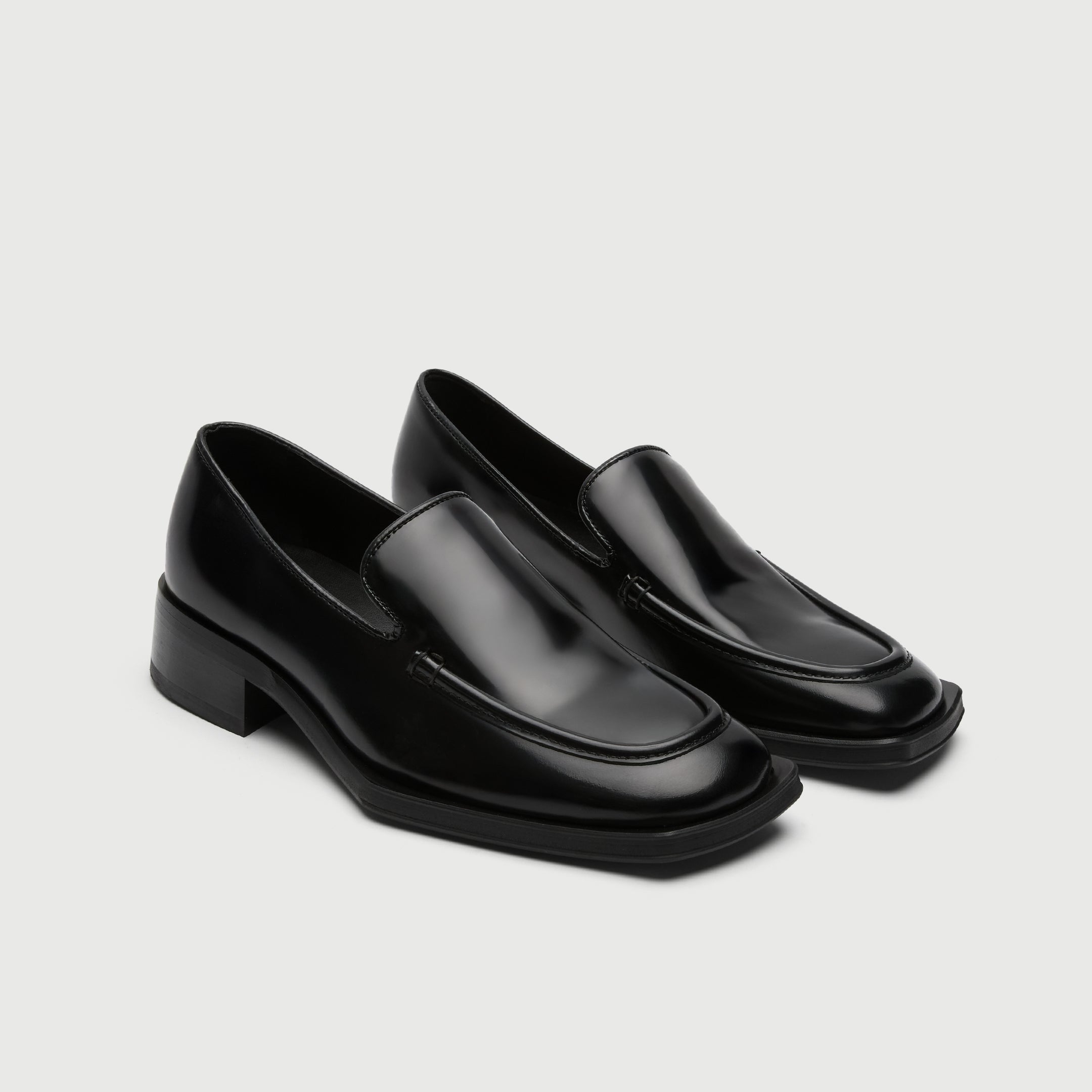 Black leather loafer with a light grey background - Walk London Abbey Loafer Side Quarter View