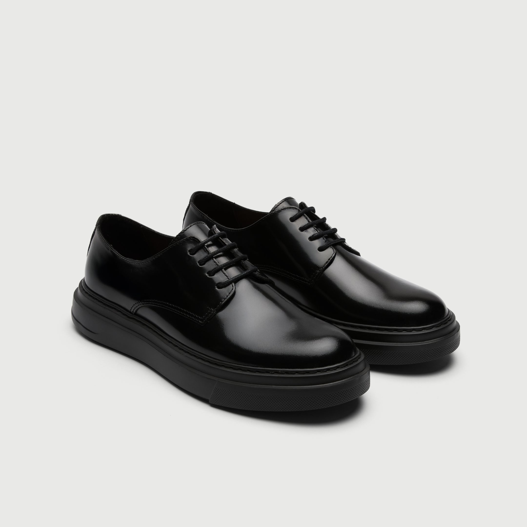 Video of man wearing Walk London Bronx Black Leather Derby Shoes with wide black trousers