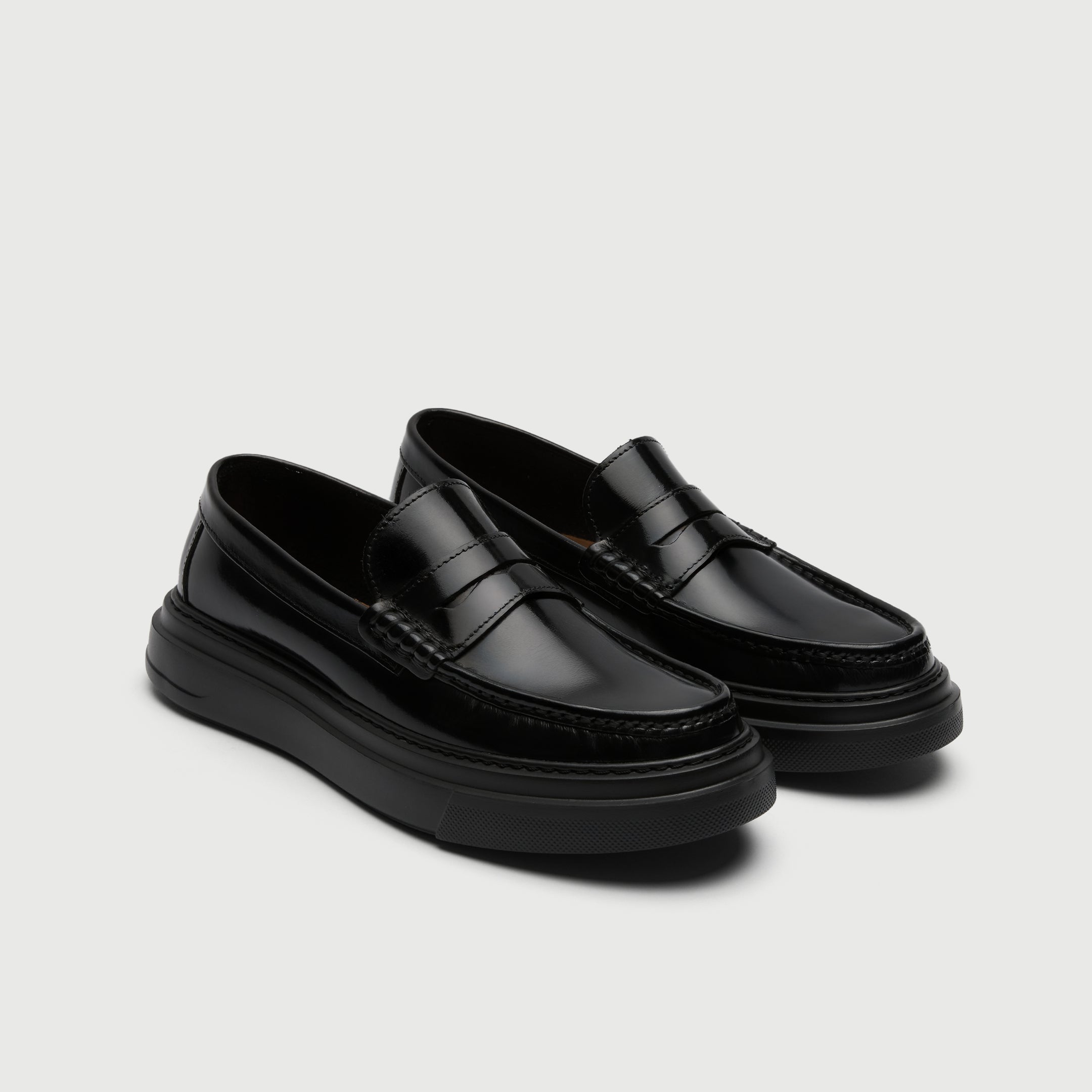 Video of man wearing Walk London Bronx Black Leather Saddle Loafers with wide black trousers