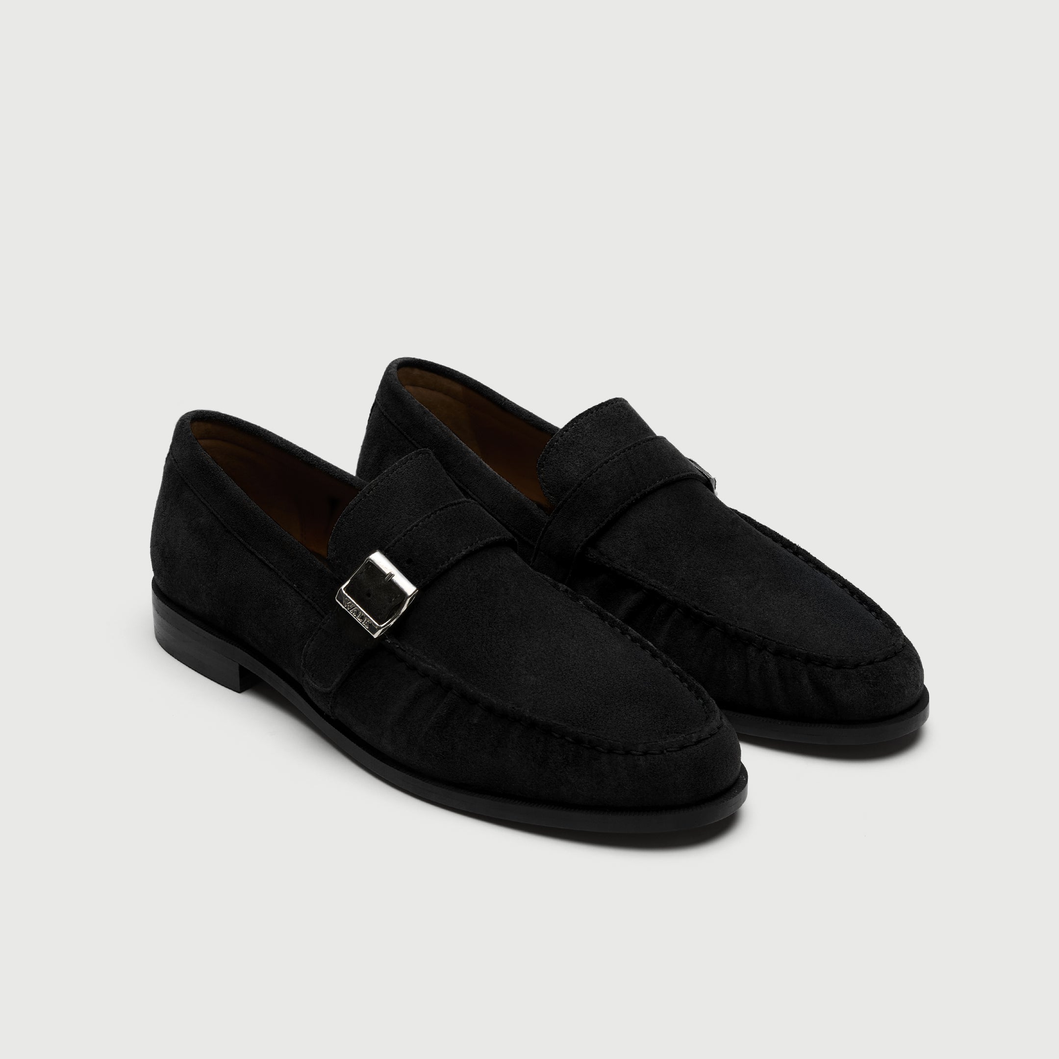 Video of man wearing Walk London Como Black Suede Loafers with buckle and wide khaki trousers