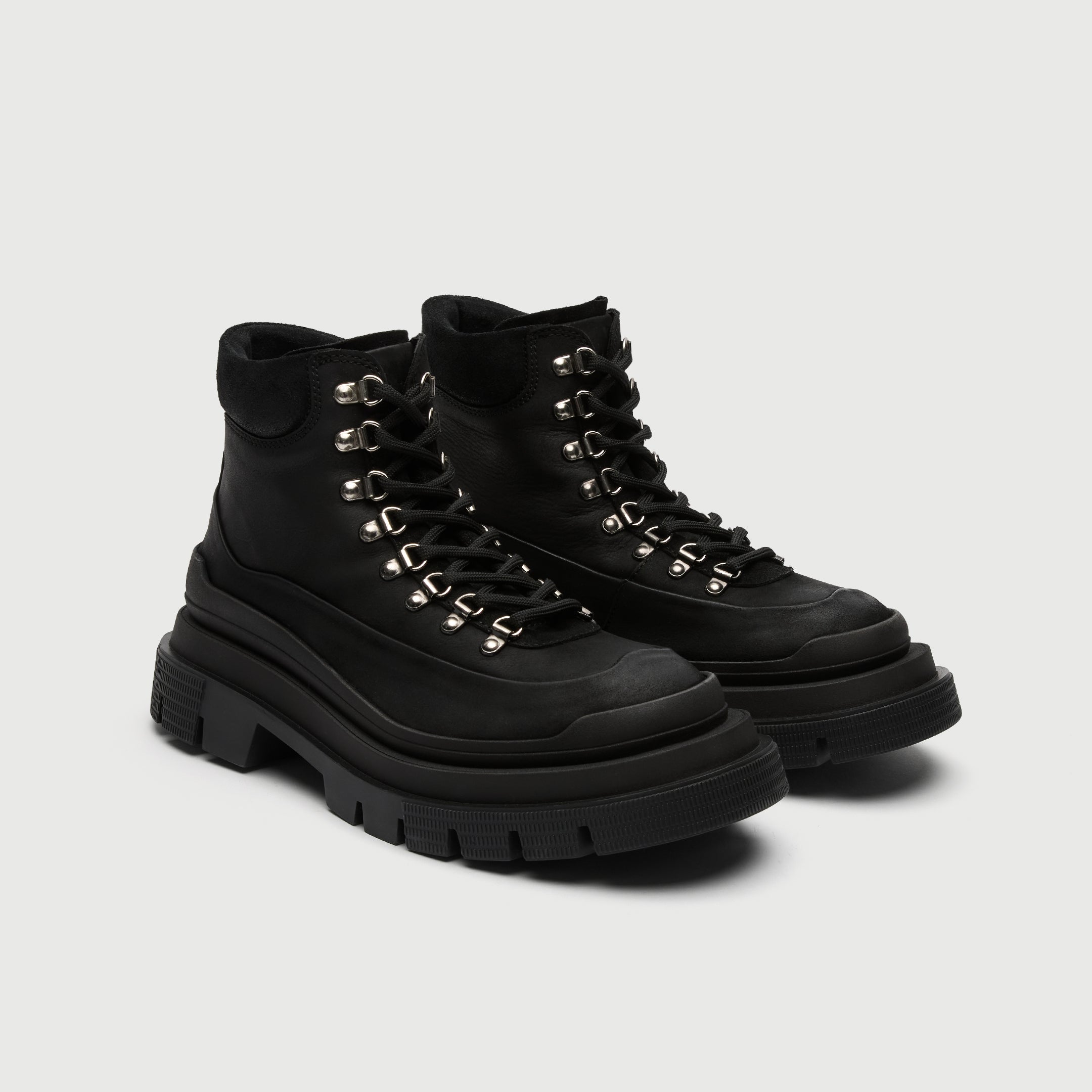 Walk London pair of black Highgate hiking boot with thick sole on a light grey background