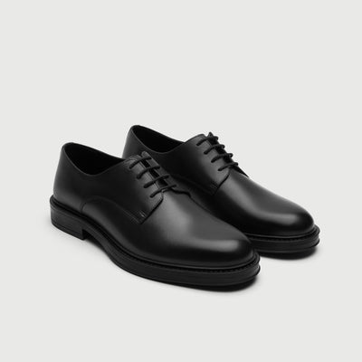 Video of man wearing Walk London Vincent Black Leather Derby Shoes with   wide black trousers