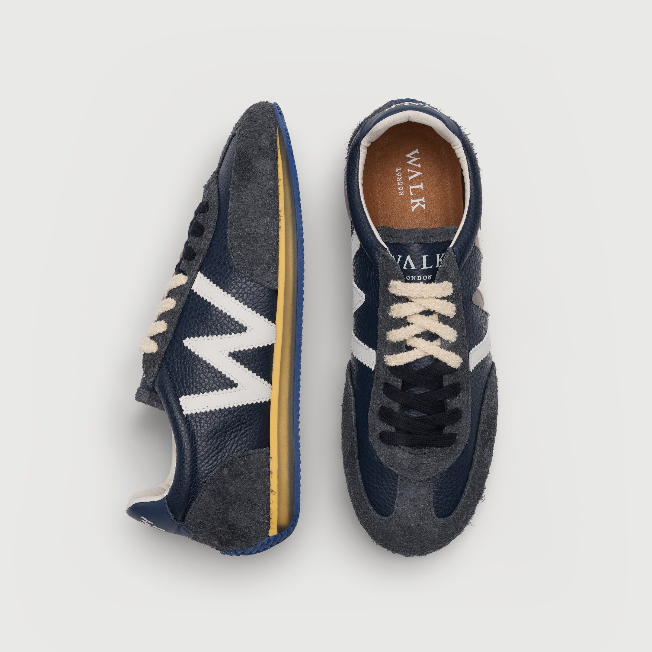 Walk London Retro Runner Trainers in Blue Brushed Suede and Grain Leather top and side view, half with white hairy laces and half with dark blue flat lace