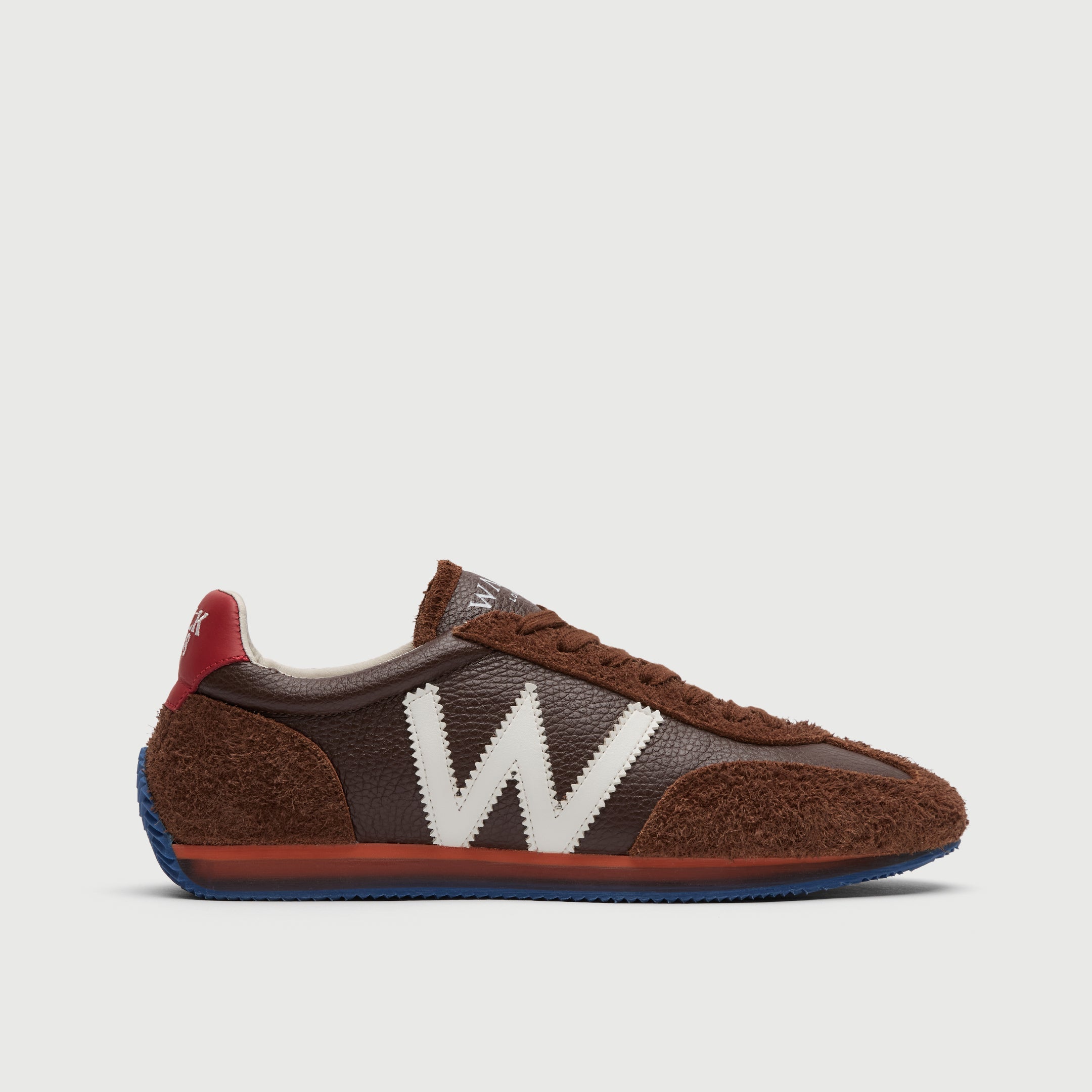 Walk London Retro Runner Trainer in Brown Brushed Suede and Grain Leather side view showing white W detail, with orange and translucent midsole and blue outsole and red heel counter