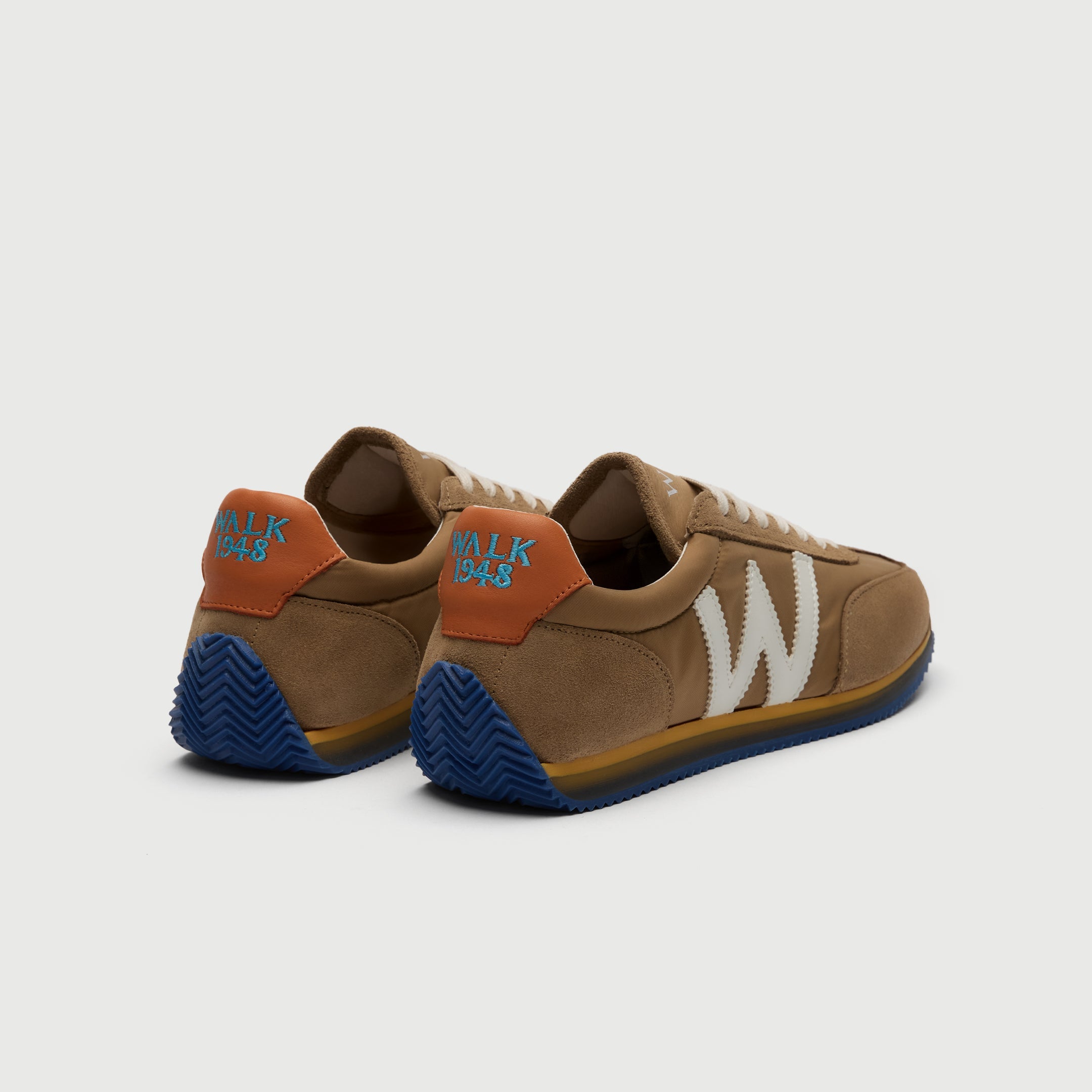 Walk London Retro Runner Trainer in Stone suede and textile heel view with blue sole and 1948 embroidered on collar