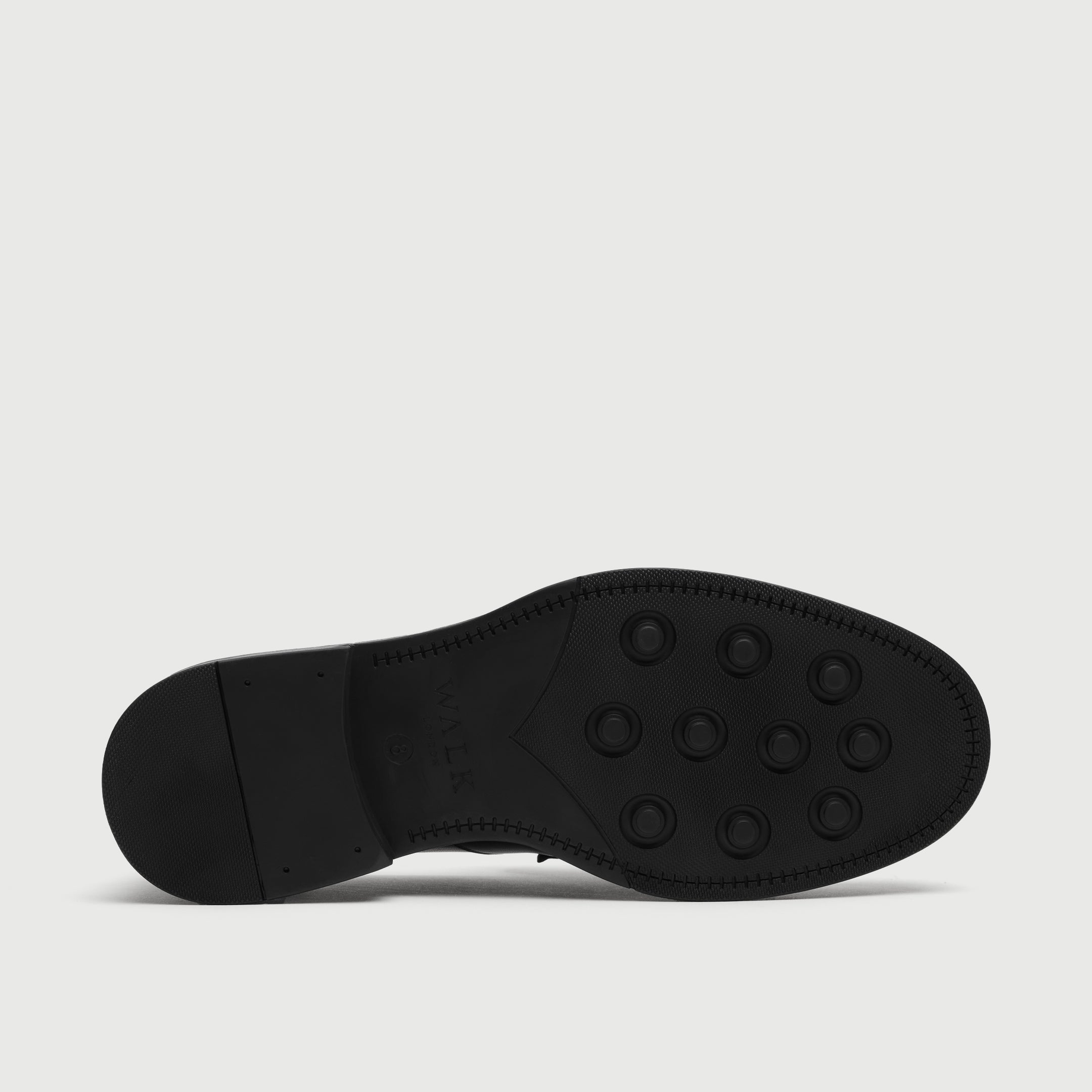 Walk London Richmond Tassel Loafer black sole with round recessed lugs and debossed branding