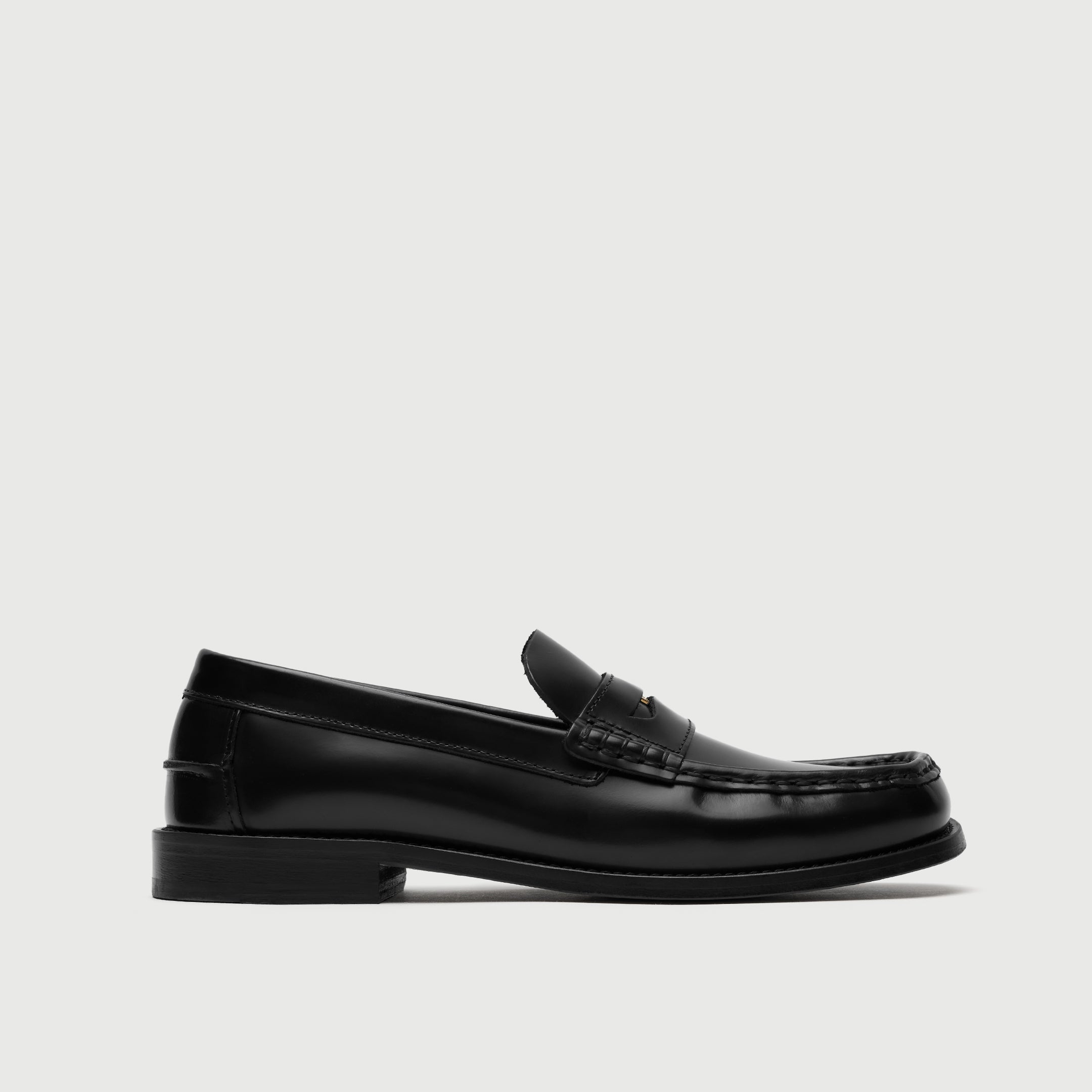 Walk London Shoreditch Penny Loafer in Black Leather side view showing beefroll stitching