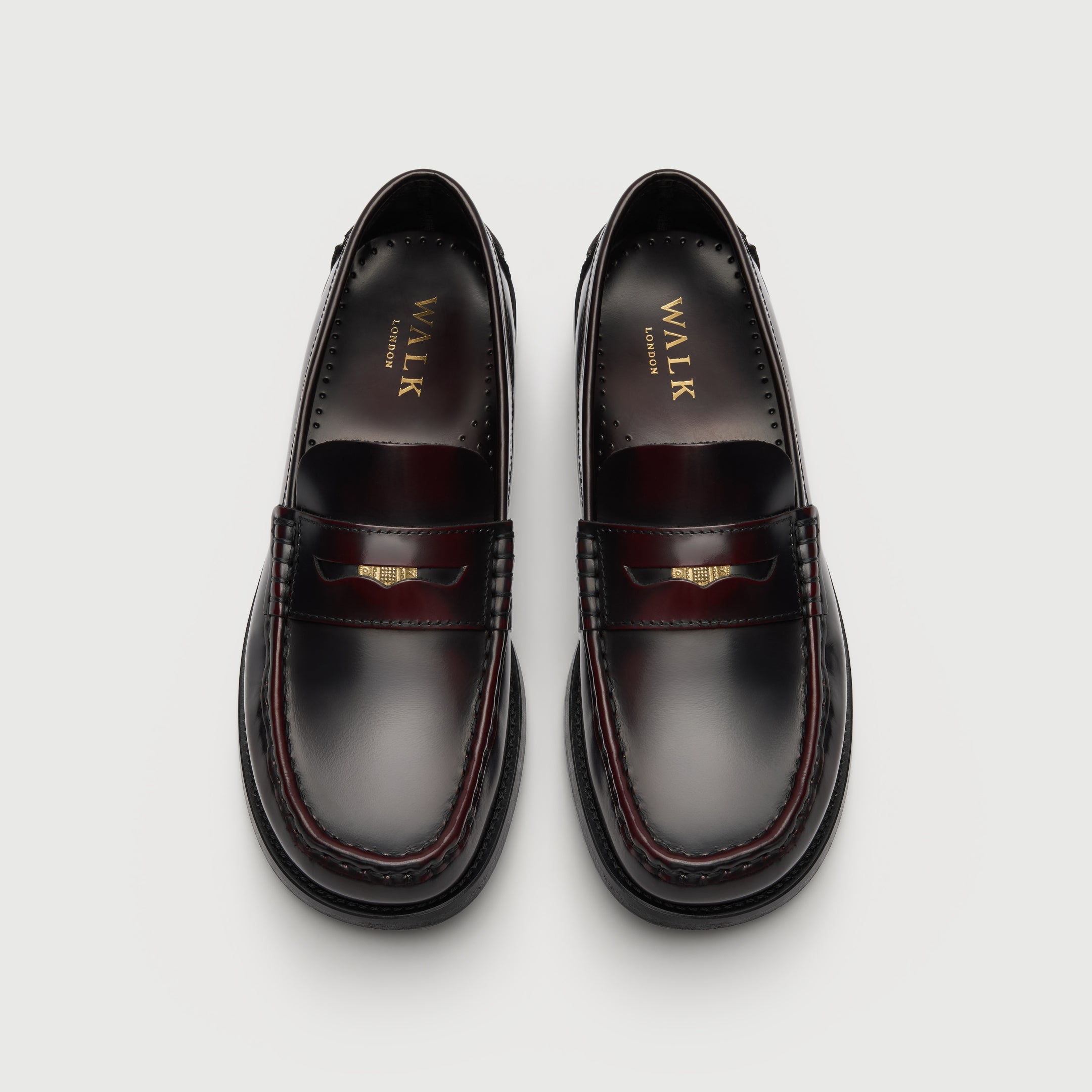 Walk London Shoreditch Penny Loafer in Burgundy Leather top view showing squared toe shape, gold foil branding on insole, and gold penny stored in the saddle strap