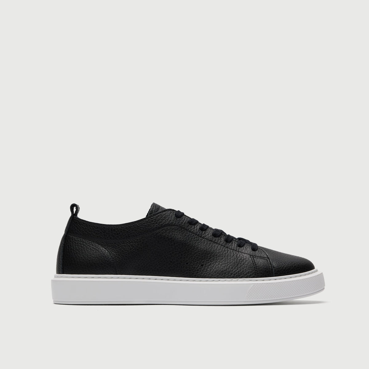 Walk London Wimbledon Trainer in Black Grain Leather side view with white sole